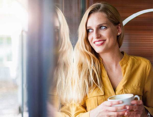 A woman at a coffee shop, a good place to meet single women.