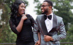 A woman and her boyfriend dressed up for an event and laughing even though the woman is future tripping a little bit.