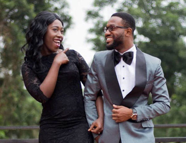 A woman and her boyfriend dressed up for an event and laughing even though the woman is future tripping a little bit.