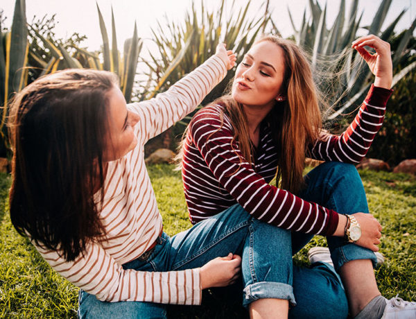 A girl who's in a one-sided friendship talking to her friend who isn't paying much attention.