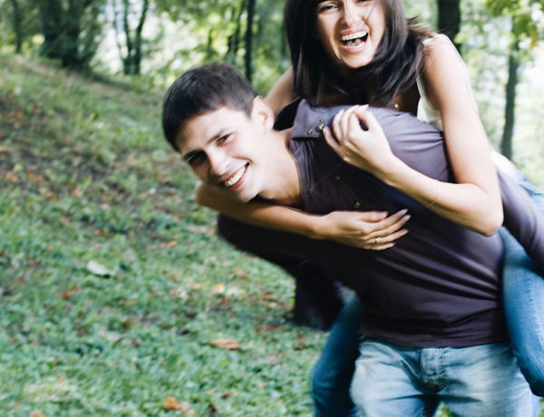 A guy with a girl best friend, carrying her on his back as they laugh and tease each other.