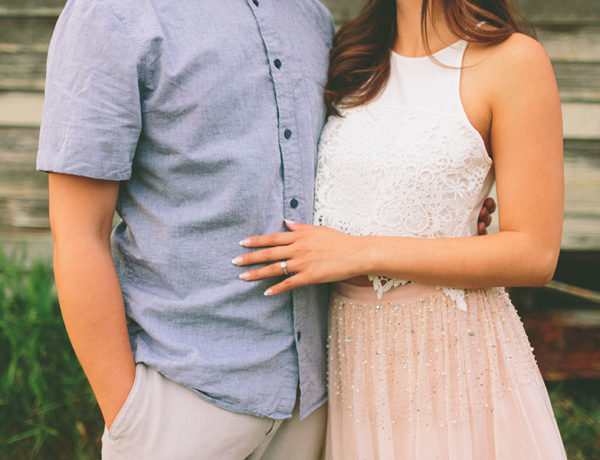 A man who was showing signs he wants to marry you, standing next to his finance as she shows off her ring.