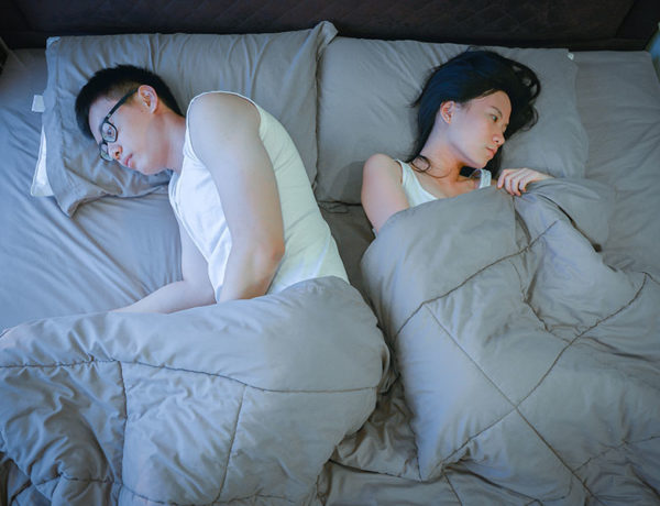 A women who knows we both cheated on each other in bed next to her husband, wondering what to do.