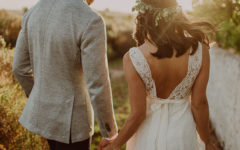A couple who found out that marriage was right for them holding hands at their wedding.