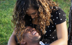 A couple talking and active listening while sitting in the grass.