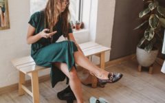 Woman trying on shoes for her first date outfit