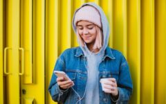 Pretty blonde woman having tinder conversations on her phone