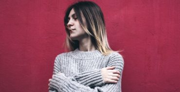 Woman looking pensive after being told by her partner that I love you but I'm not in love with you